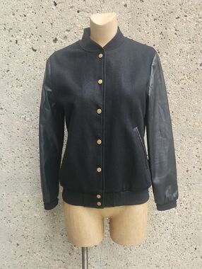 Hilary McMillian black varsity jacket